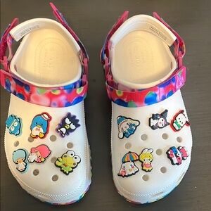 Crocs platform with colorful strap and hello kitty charms.
